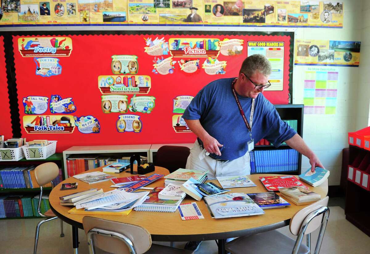 Fifth grade teacher Marc LaPierre prepares for the opening day of school at Mathewson School in Milford, Conn., on Tuesday Aug. 23, 2016. Kids come back to class on Aug. 29th.