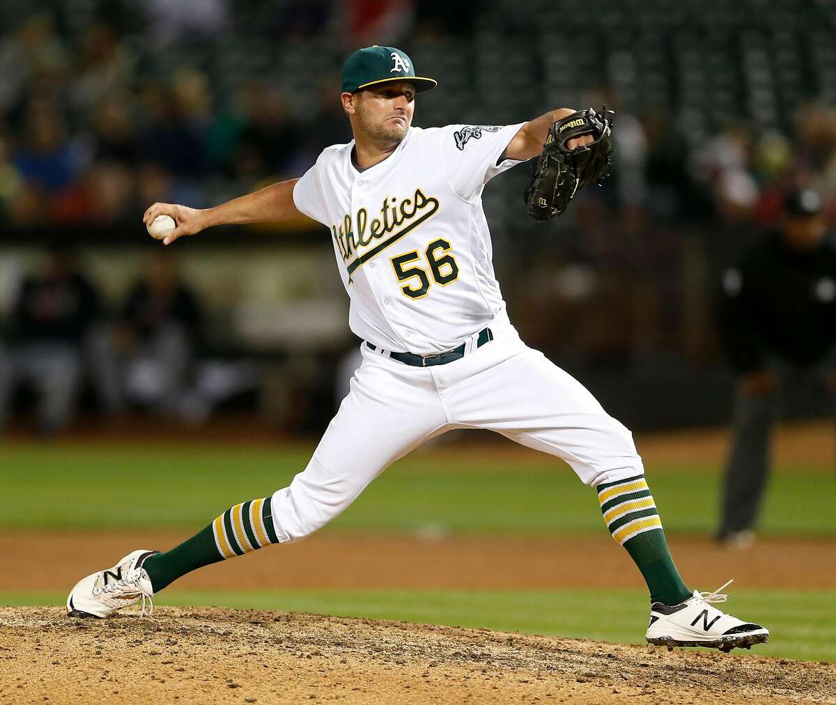 Oakland Athletics' Chris Smith pitches in 9th inning of A's 9-1 win over Cleveland Indians in MLB game at Oakland Coliseum in Oakland, Calif., on Tuesday, August 23, 2016.