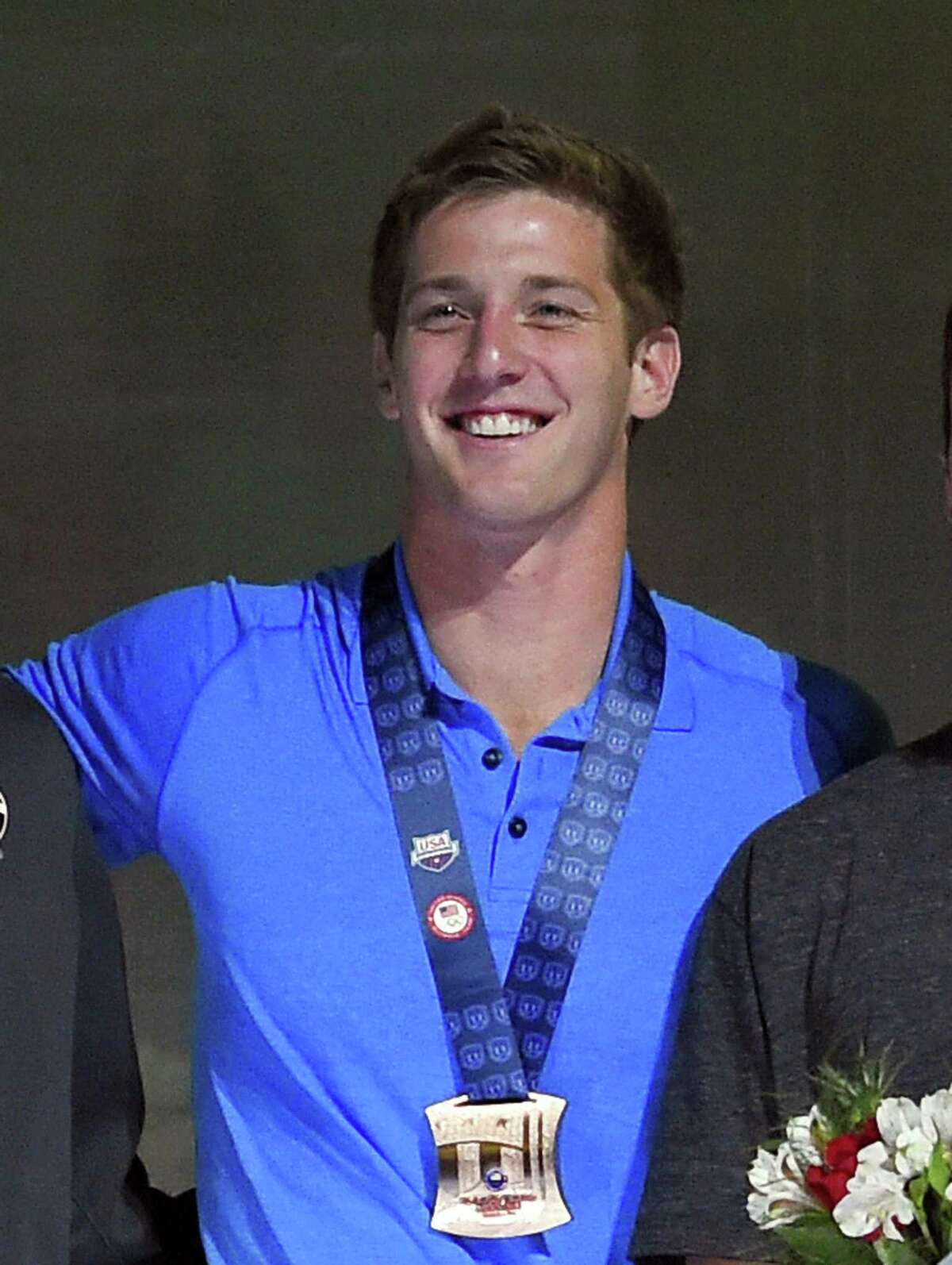Former Churchill and UT standout Jimmy Feigen smiles during the men’s 400-meter relay team medal ceremony at the U.S. Olympic Swimming Trials, in Omaha, Neb., on July 3, 2016.