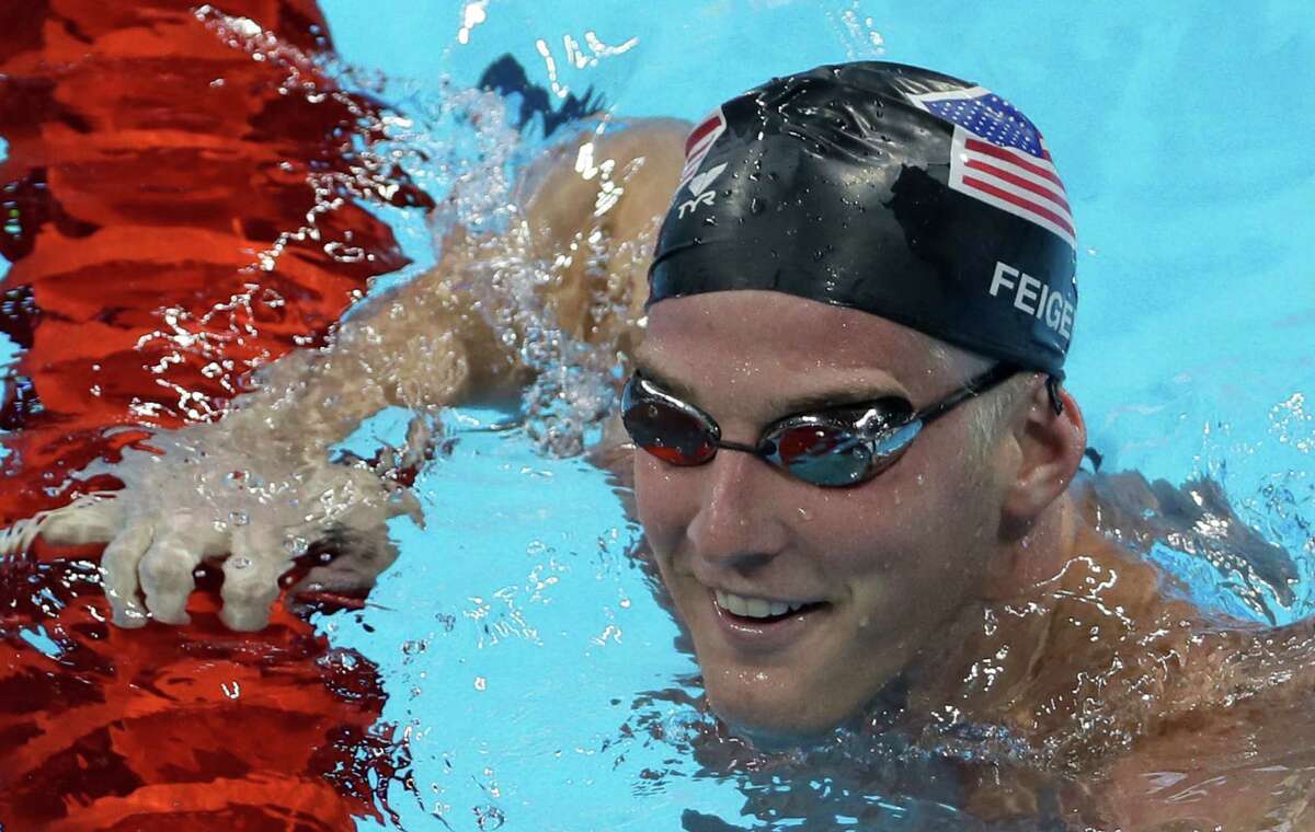 In this Aug. 2, 2016, file photo, U.S. swimmer James Feigen smiles during a swimming training session prior to the 2016 Summer Olympics in Rio de Janeiro, Brazil. Feigen apologized for the “serious distraction” he and three teammates caused at a gas station during the Rio Olympics, saying he omitted facts in his statement to police. Feigen says in a statement posted Tuesday, Aug. 23, 2016, on the website of his lawyer in Austin that “I omitted the facts that we urinated behind the building and that Ryan Lochte pulled a poster off the wall.”