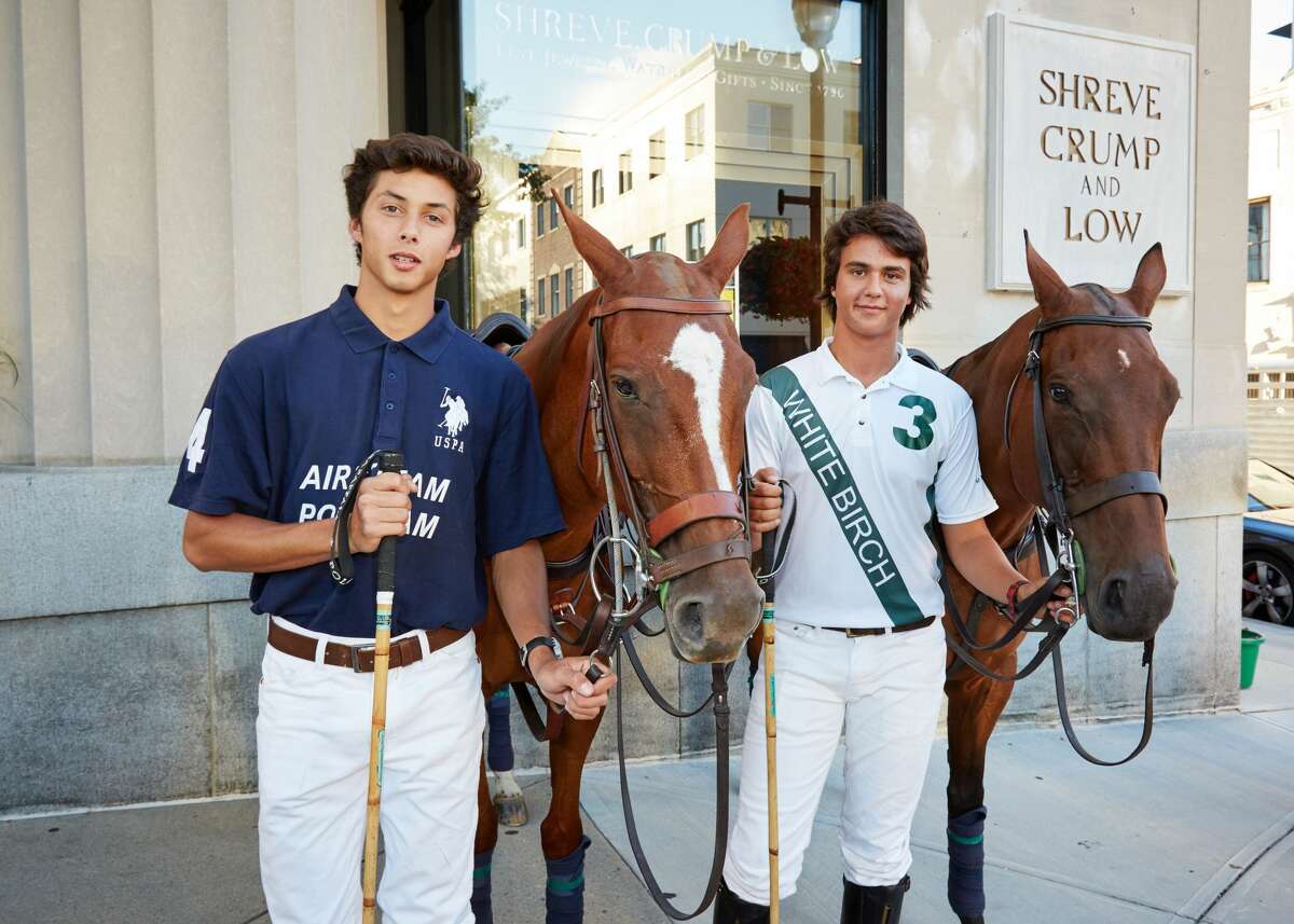 The East Coast Open is considered the biggest polo tournament of the summer in the United States. It takes place at Greenwich Polo Club and will feature eight of the best polo teams in the world. Matches are open to the public on August 28, September 4 and September 11. A draw party, held at Shreve, Crump & Low in Greenwich on August 23, 2016, is decided each polo teams’ placement in the tournament. Two polo players and polo ponies greeted the public outside on Greenwich Avenue to kick-off the polo tournament.
