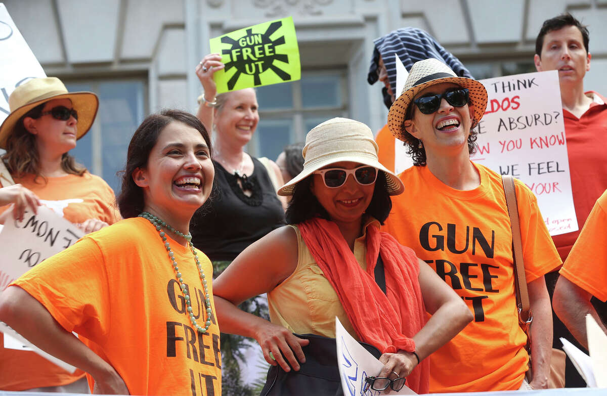 A group calling itself Gun Free UT protests the campus carry law on the steps of the main building (tower) on the University campus Wednesday August 24, 2016.