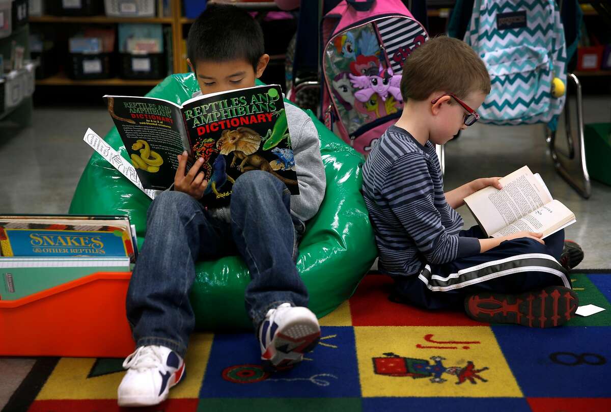 Sean Chaskin (left) and Jack Fahlgren read books in Joy Larkin's 3rd grade class at Serra Elementary School in San Francisco, Calif. on Wednesday, Aug. 24, 2016. A new literacy program has led to a dramatic improvement in test scores at Serra.