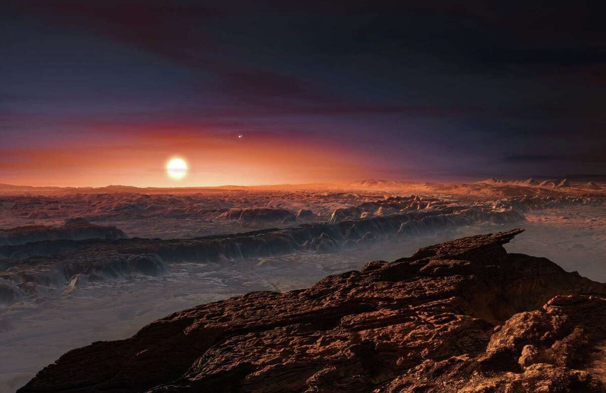 A hand out image made available by the European Southern Observatory on August 24 2016, shows an artist's impression of a view of the surface of the planet Proxima b orbiting the red dwarf star Proxima Centauri, the closest star to the Solar System. The double star Alpha Centauri AB also appears in the image to the upper-right of Proxima itself. Proxima b is a little more massive than the Earth and orbits in the habitable zone around Proxima Centauri, where the temperature is suitable for liquid water to exist on its surface. Scientists on August 24, 2016 announced the discovery of an Earth-sized planet orbiting the star nearest our Sun, opening up the glittering prospect of a habitable world that may one day be explored by robots. Named Proxima b, the planet is in a "temperate" zone compatible with the presence of liquid water -- a key ingredient for life. / AFP PHOTO / EUROPEAN SOUTHERN OBSERVATORY / M. KornmesserM. KORNMESSER/AFP/Getty Images
