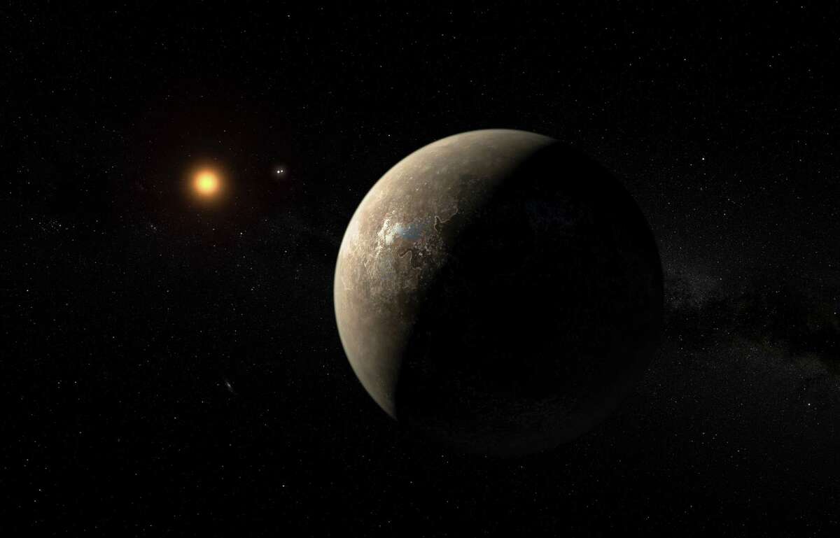 In an undated handout image, an artist’s impression of the planet Proxima b orbiting Proxima Centauri, the closest star to Earth’s sun. Astronomers announced Aug. 24, 2016, that they had detected a planet orbiting Proxima Centauri, that, intriguingly, is in the star’s “Goldilocks zone,” where it may not be too hot nor too cold, raising the possibility for life. (M. Kornmesser/European Southern Observatory via The New York Times) -- EDITORIAL USE ONLY