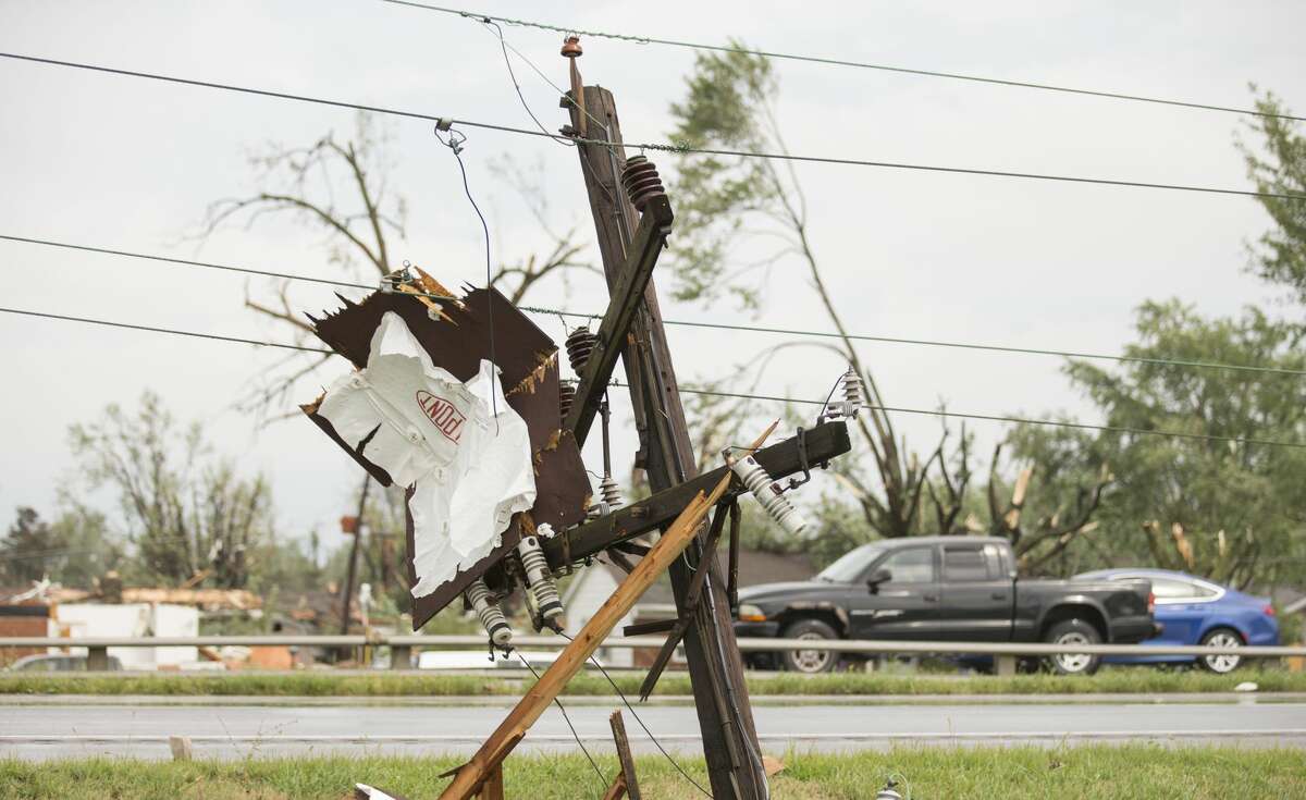 Broken power lines are the remnants of an apparent tornado that touched down in Kokomo, Ind., Wednesday, Aug. 24, 2016. (Robert Scheer/The Indianapolis Star via AP)