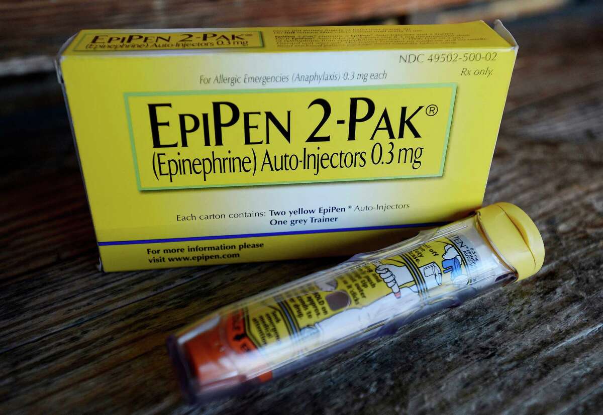 Mylan, now in the cross hairs over severe price hikes for its EpiPen, said Thursday it will expand programs that lower out-of-pocket costs by as much as half.