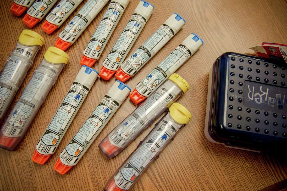 EpiPens used for training school staff members are shown in Ashburn, Va. Mylan is not lowering the list price of EpiPen, just making it easier for consumers to pay for it. So insurance companies, federal health programs such as Medicare and Medicaid and school districts that stock the products could still pay the same price.