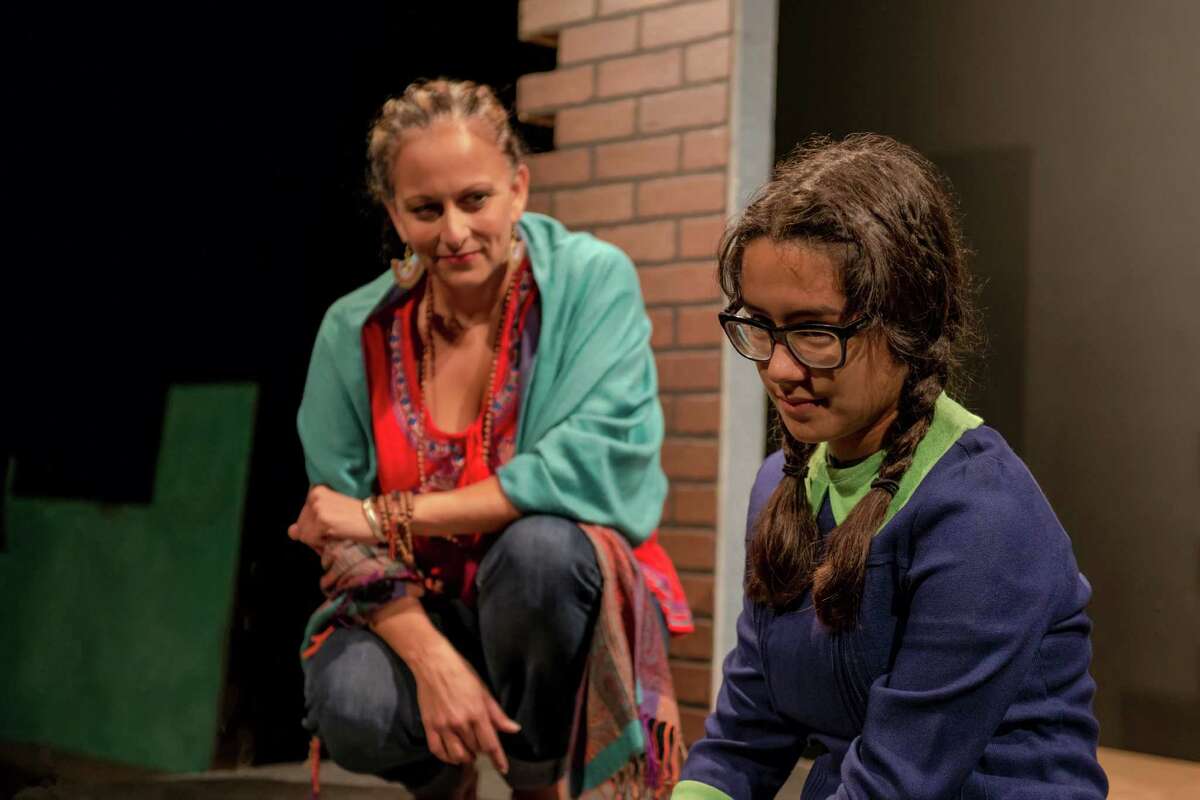 Gypsy Pantoja (from left) and Valentina Inéz Barrera-Ibarra share the role of Esperanza as a woman and as a child in Classic Theatre's staging of "The House on Mango Street."
