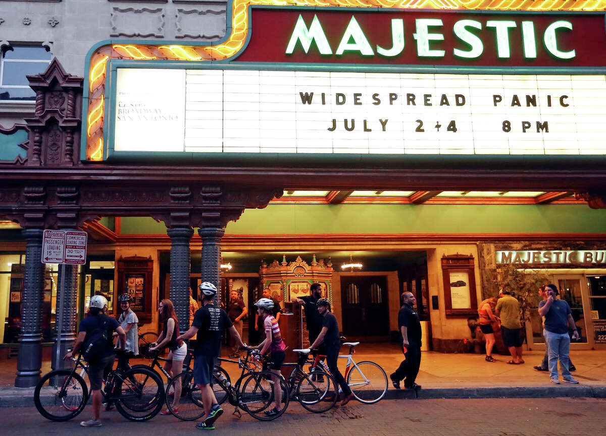 Cyclist participating in the Thursday Night Social Skoach stop at the Majestic Theatre Thursday July 2, 2015.