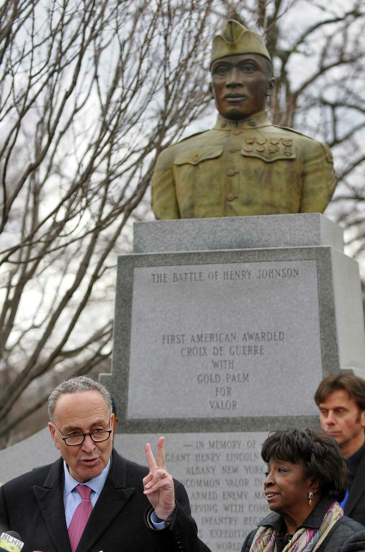 U.S. Senator Charles E. Schumer announces that newly discovered documents will enhance Sgt. Henry Johnson's chance of receiving the Medal of Honor, at the World War I hero's statue in Washington Park on Tuesday March 22, 2011 in Albany, NY. Albany County Legislators Lucille McKnight and Brian Scavo are at right. ( Philip Kamrass/ Times Union )