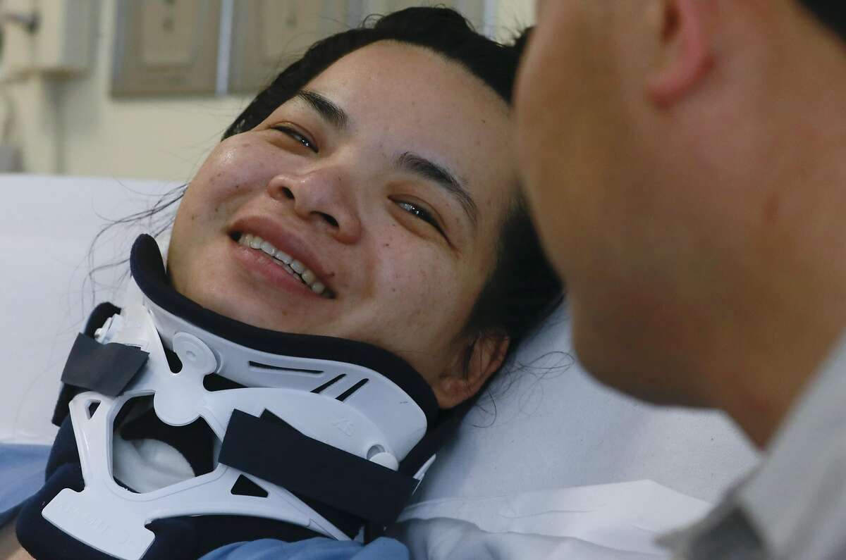 Emma Zhou smiles at her husband Tony Tan at Laguna Honda Hospital in San Francisco, California on Thurs. August 25, 2016, where she is recovering after a tree branch fell onto her at Washington Square Park, leaving her paralyzed from the waist down.