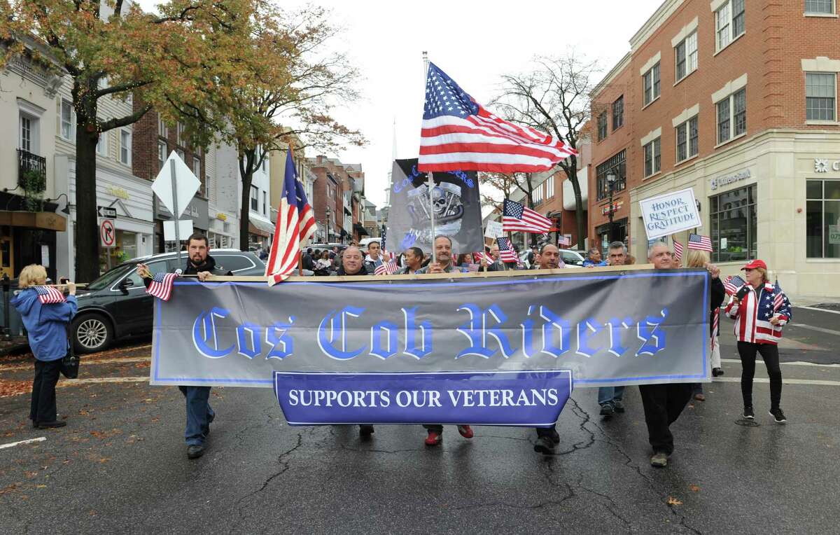 Greenwich Military Covenant of Care Veteran's Day March down Greenwich Avenue to the Arch Street War Memorial in Greenwich, Conn. Tuesday, Nov. 11, 2015. Dozens of local veterans took a patriotic stroll down Greenwich Avenue before a short ceremony where many shared stories and memories from their time in the service.