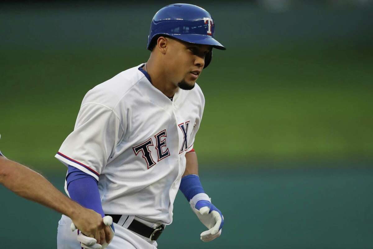 Carlos Gomez of the Texas Rangers runs the bases after hitting a three-run home run against the Cleveland Indians in the second inning at Globe Life Park in Arlington on August 25, 2016 in Arlington, Texas.