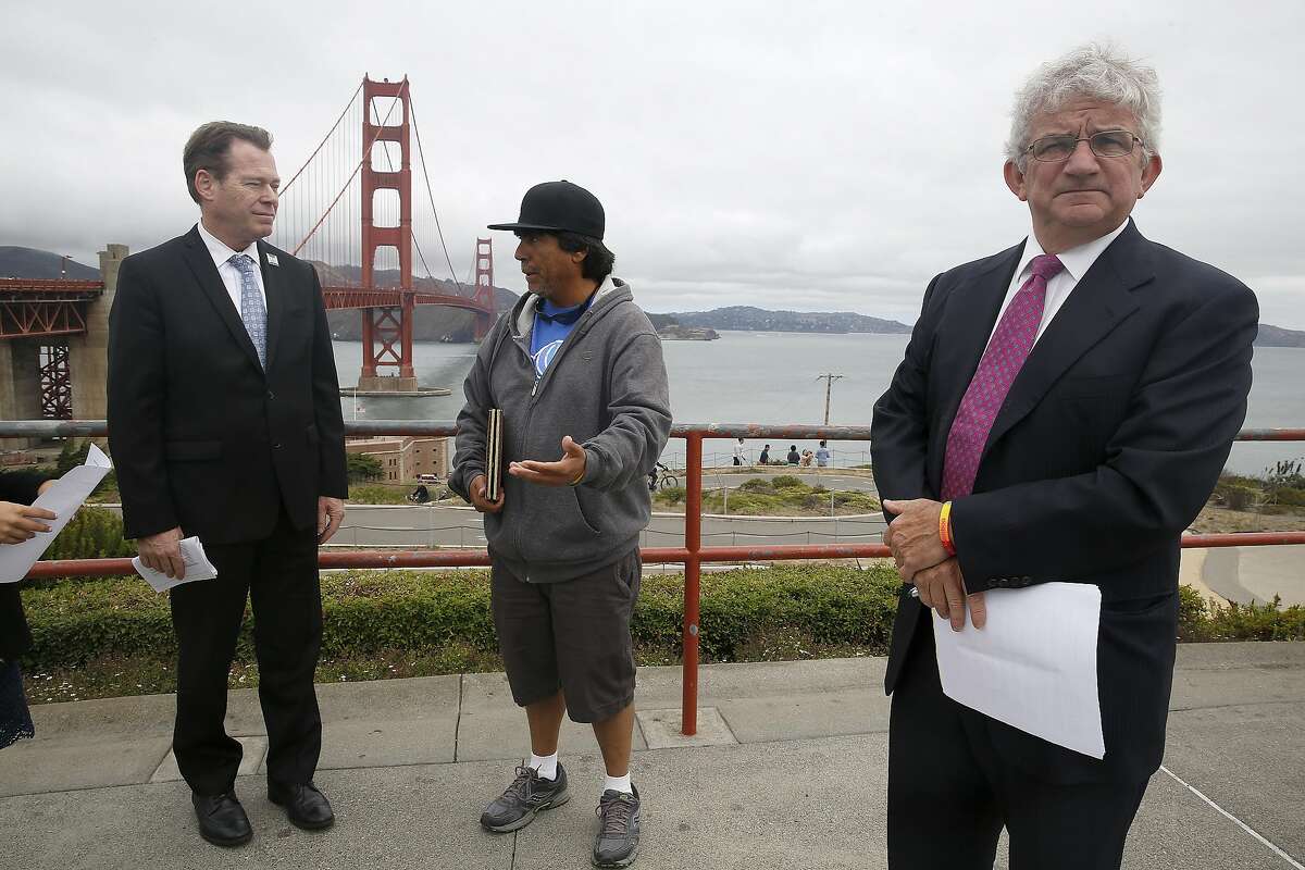 Manuel Gamboa talked to Dennis Mulligan (left) about his son's suicide and supports the crisis text line on Friday, August 26, 2016, in San Francisco, Calif. At right is Golden Gate Bridge Board of Directors Dick Grosboll.