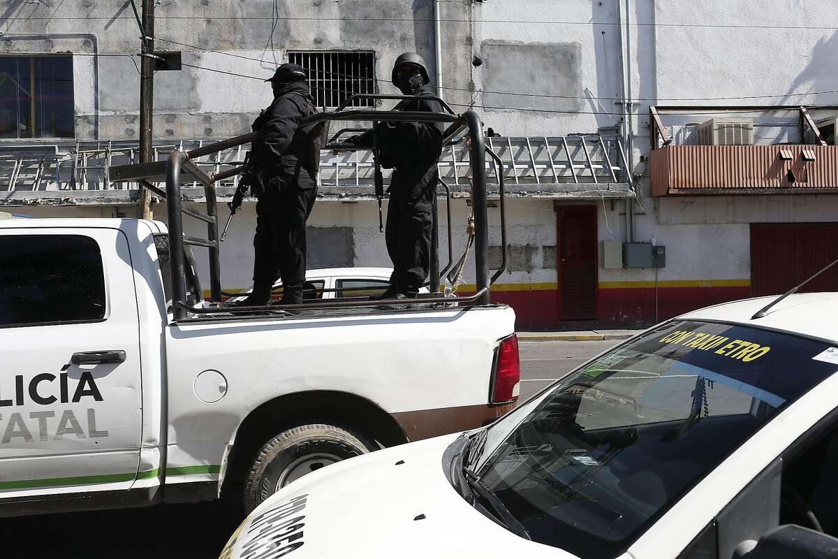 The Tamaulipas State Police patrols the downtown streets of Nuevo Laredo, Mexico, Wednesday, August 25, 2016. A spate of violence has erupted throughout section of Nuevo Laredo as drug cartels fight for control. The Tamaulipas State Police and the Mexican Army are collaborating and patrol the city's streets in an attempt to bring calm to the area.