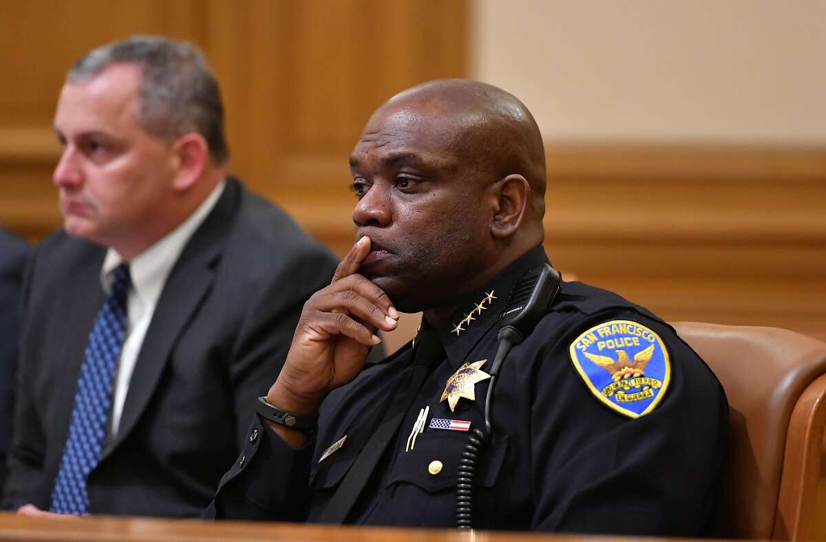 San Francisco Police Chief Toney Chaplin listens as Geoffrey King speaks to commissioners at City Hall in San Francisco on August 10, 2016. Allowed only two minutes of speaking per person, King arranged for he and his friends to take turns reading about how his mother was taken from a residential care home by police where she was being treated for dementia and placed on a psychiatric hold.