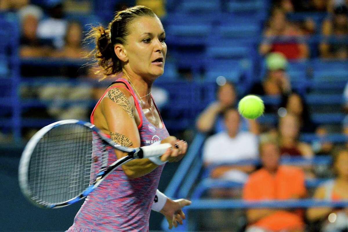 NEW HAVEN, CT - AUGUST 26: Agnieszka Radwanska of Poland returns a shot to Petra Kvitova of the Czech Republic on day 6 of the Connecticut Open at the Connecticut Tennis Center at Yale on August 26, 2016 in New Haven, Connecticut. (Photo by Alex Goodlett/Getty Images)