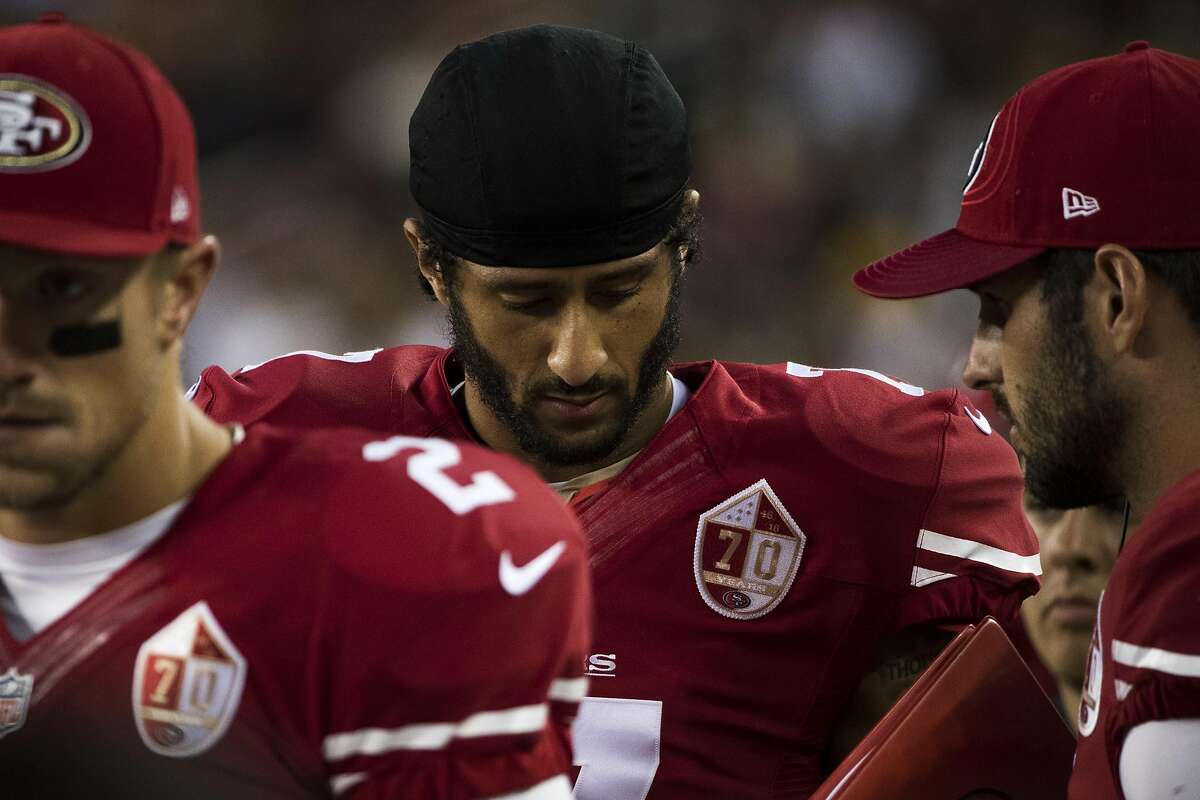 Colin Kaepernick, San Francisco 49ers QB, Sits Out National Anthem