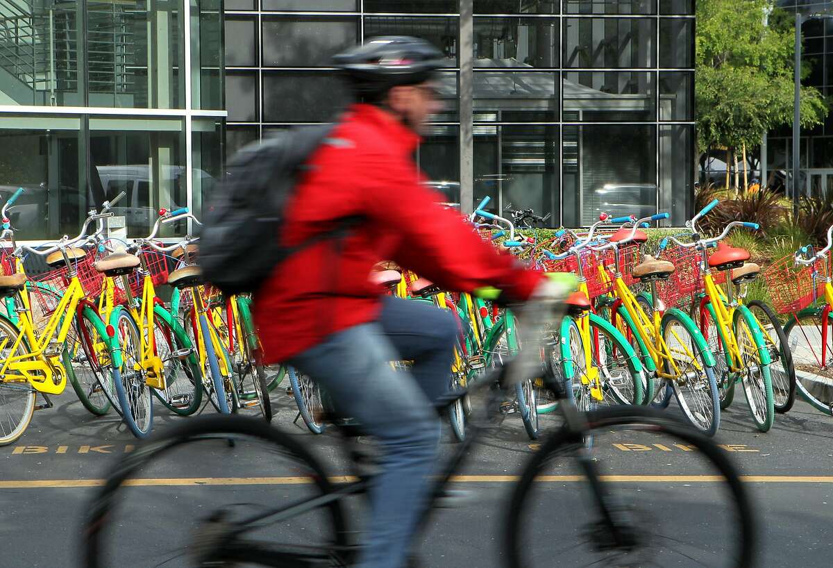 A cyclist makes his way around during Bike to Work Day at the Googleplex, Thursday, May 14, 2015, in Mountain View, Calif. 