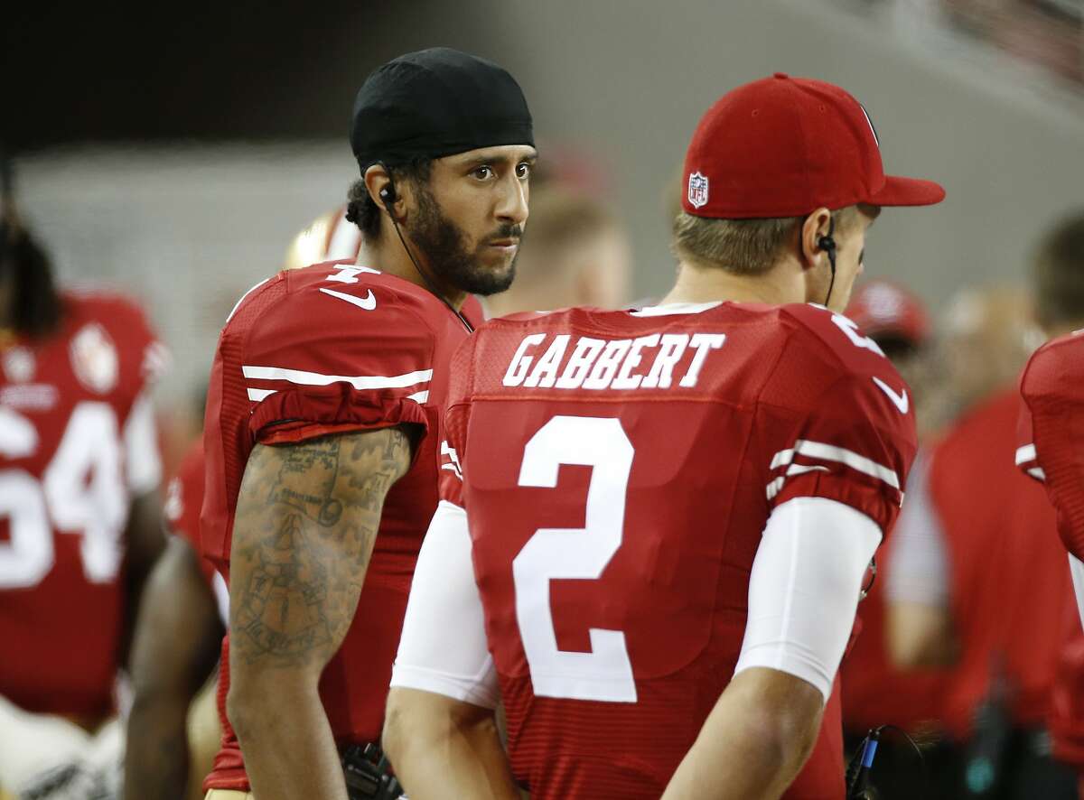 San Francisco 49ers quarterbacks Colin Kaepernick, left, and Blaine Gabbert stand on the sideline during the second half of an NFL preseason football game against the Green Bay Packers on Friday, Aug. 26, 2016, in Santa Clara, Calif. Green Bay won 21-10. (AP Photo/Tony Avelar)