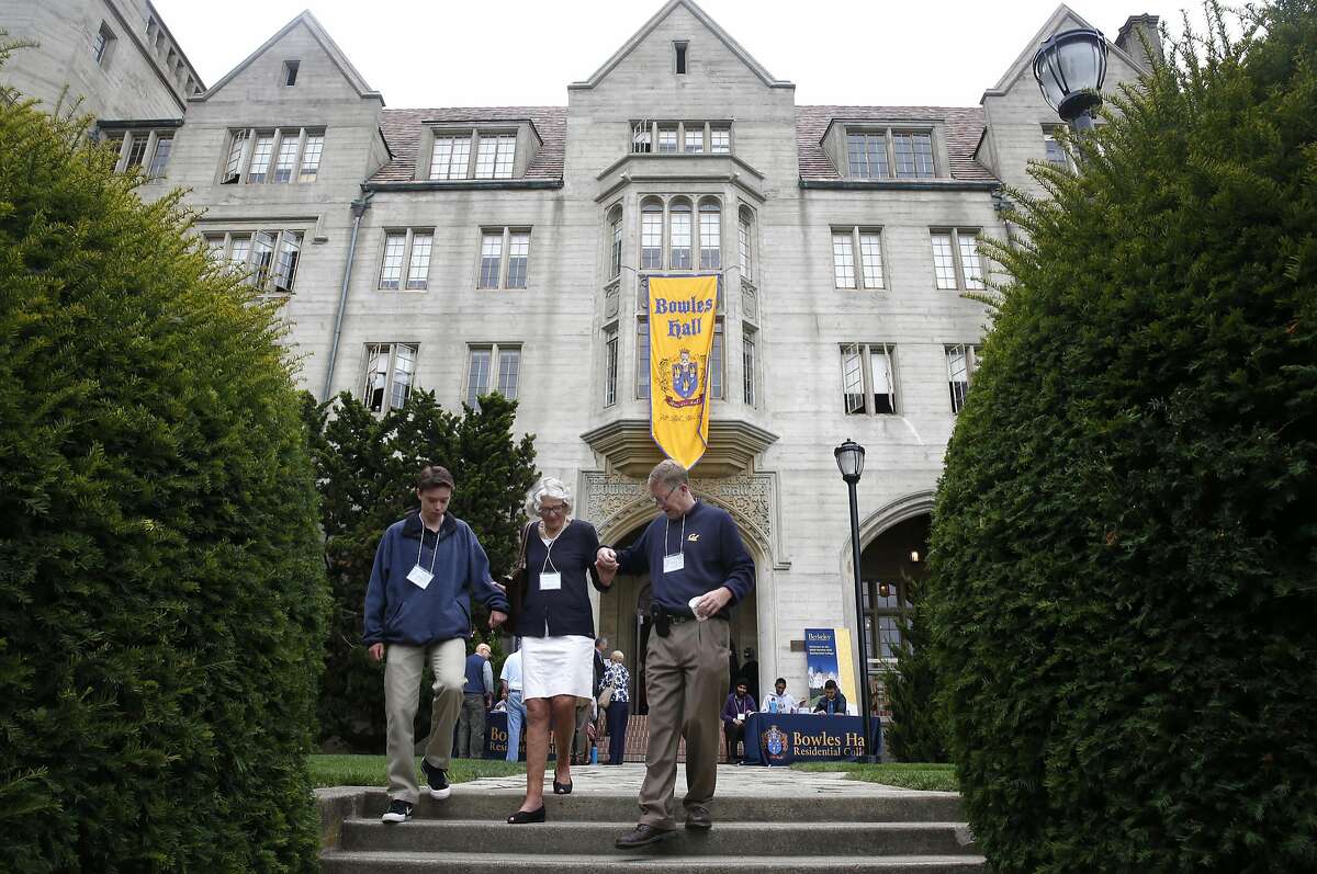 David Juhl (right), a resident of Bowles Hall in 1983, walks down the staircase in front of Bowles with his son Justin and David's mother Claudia, after touring the building at UC Berkeley on Aug. 27, 2016. David's father Ralph was also a resident of Bowles in the 50's. The castle-like residence hall underwent a year-long extensive restoration and reopens as a residential college housing as many as 183 undergraduate students.
