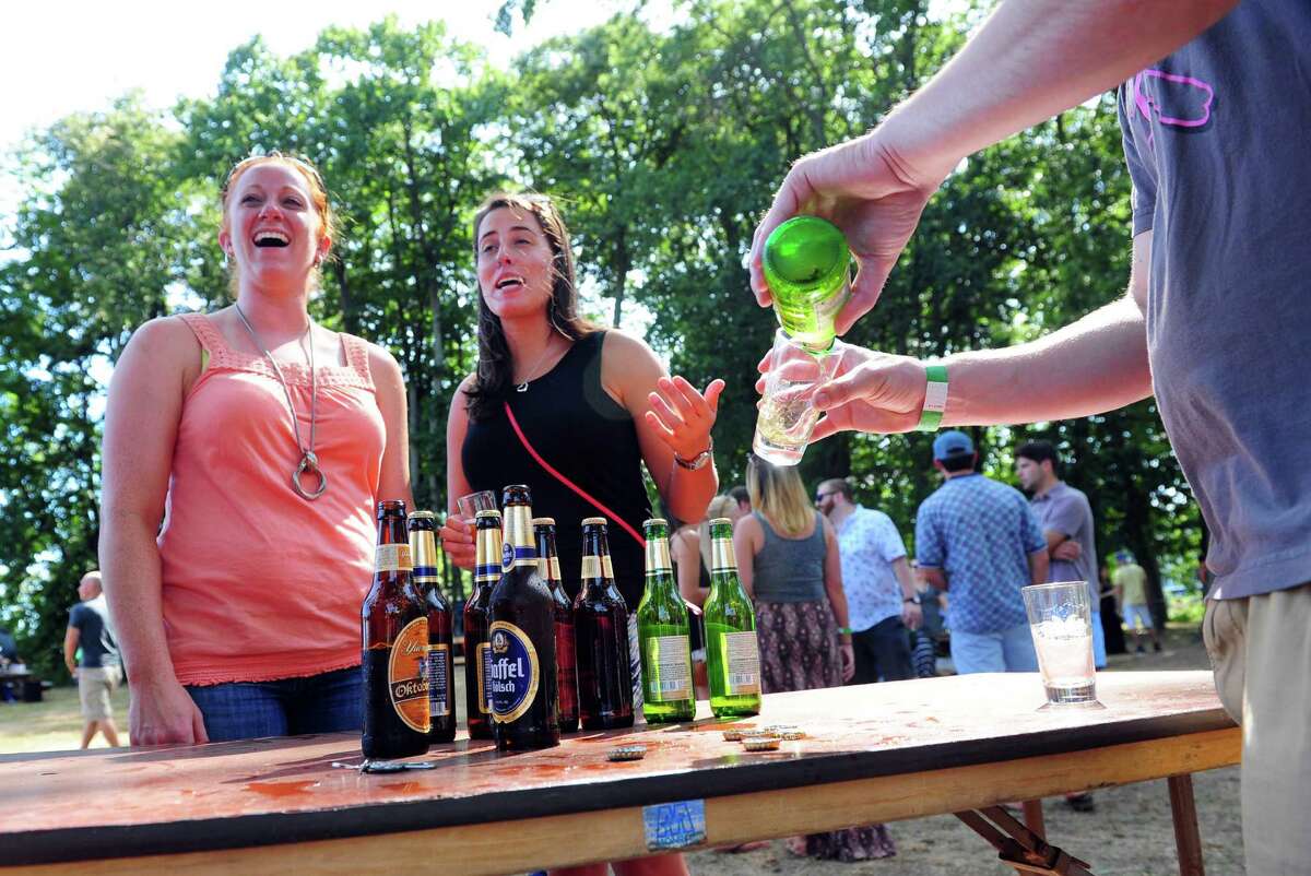 Megan Wolf, of West Hartford, left, and her friend Alyson Agler, of Stratford, try the Jever pilsner from Star Distributors at the annual ShakesBeer Festival on the grounds of the American Shakespeare Festival Theater in Stratford, Conn. on Saturday August 27, 2016. The festival showcases fine craft beers from around Connecticut as well as nearby states. The event boasts a fantastic line up of both local and regional craft breweries (more than 60 in all); a diverse range of culinary options through several renowned CT Food Trucks and live bands playing classic covers. The event is also a fundraiser for the restoration of the American Shakespeare Theater.