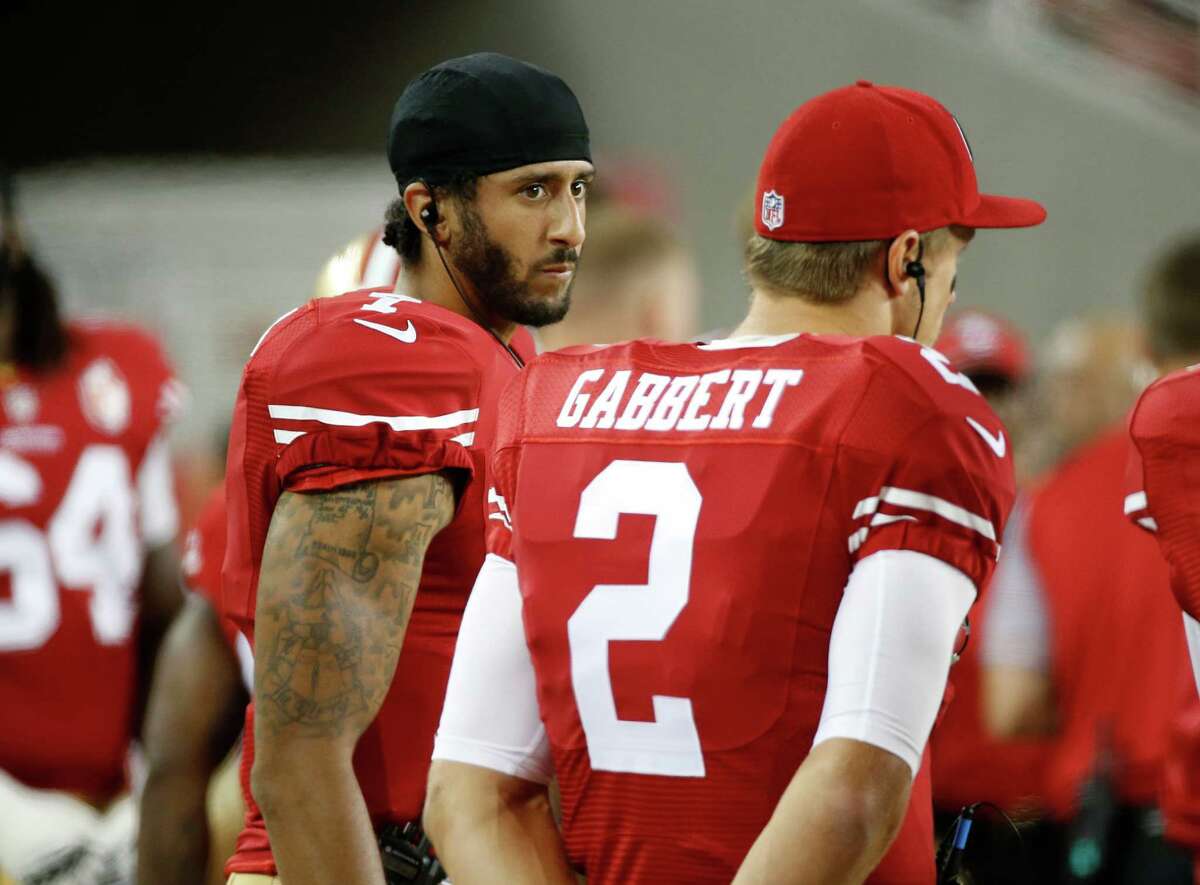 Colin Kaepernick, San Francisco 49ers QB, Sits Out National Anthem