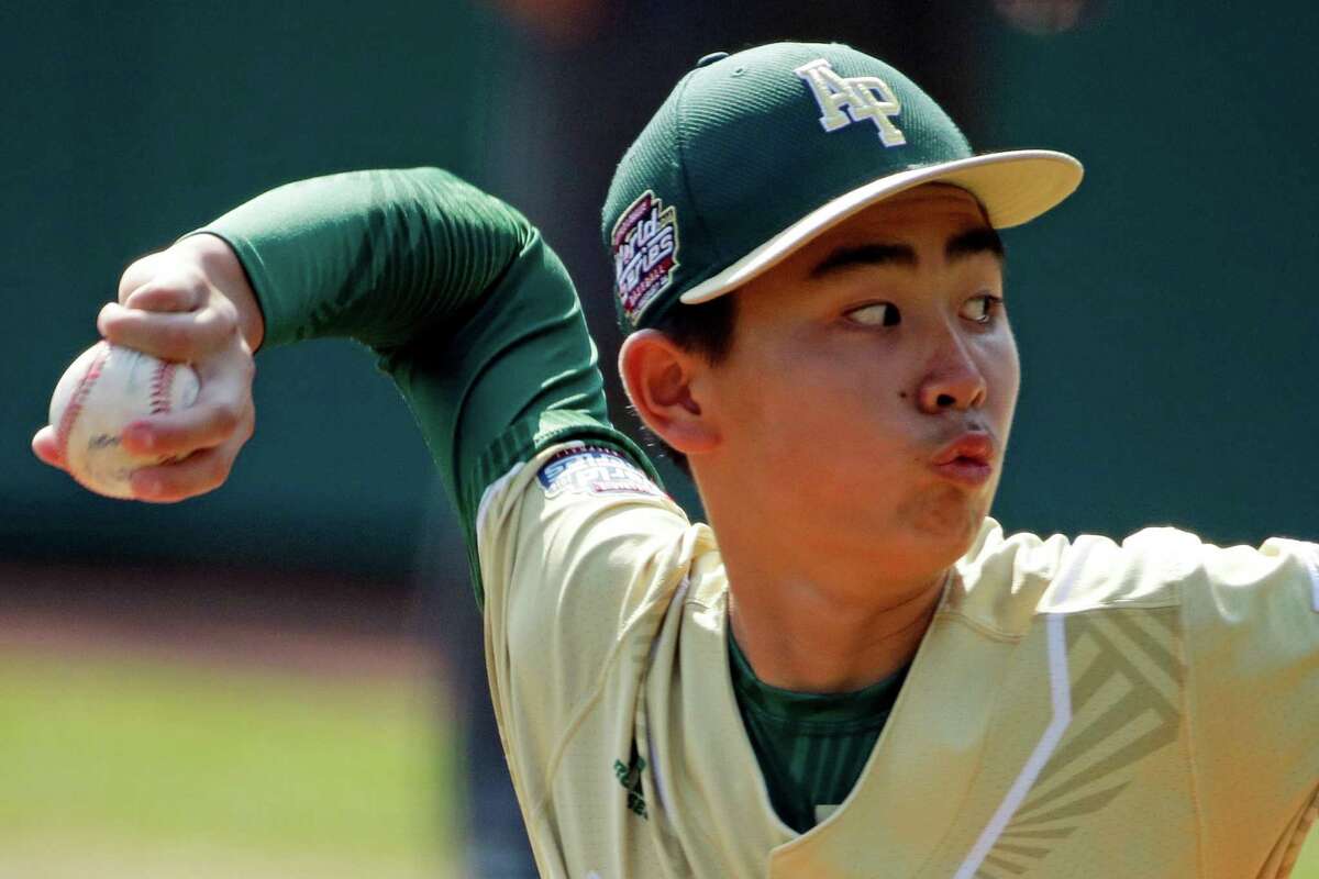 South Korea's Junho Jeong delivers during the first inning of the Little League World Series Championship baseball game against Endwell, N.Y., in South Williamsport, Pa., Sunday, Aug. 28, 2016.