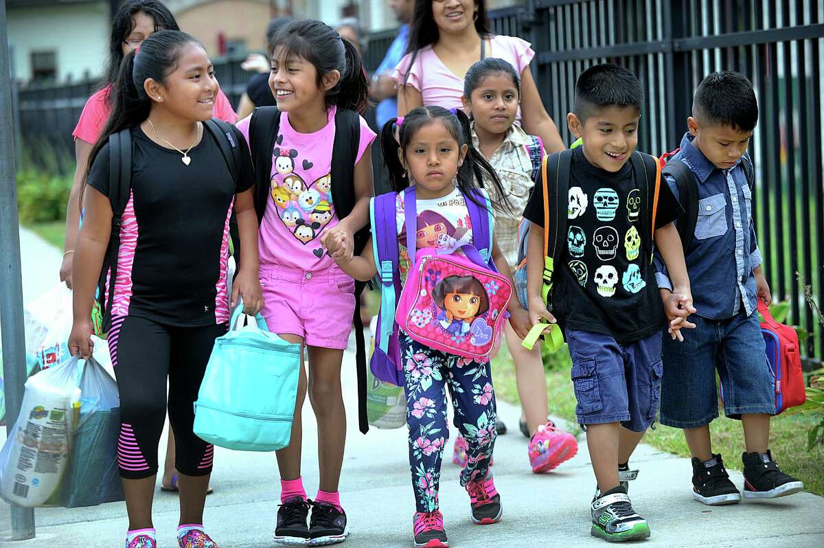 Kids arrive for the first day of school at Ellsworth Avenue School in Danbury Monday, August 29, 2016. From left are Sabrina Tapia, 9, Hailey Vizhco, 8, Joclyn Durazno, 5, Lizbeth Durazno, 7, Christopher Vizhco, 6, and Henry Durazno, 6.