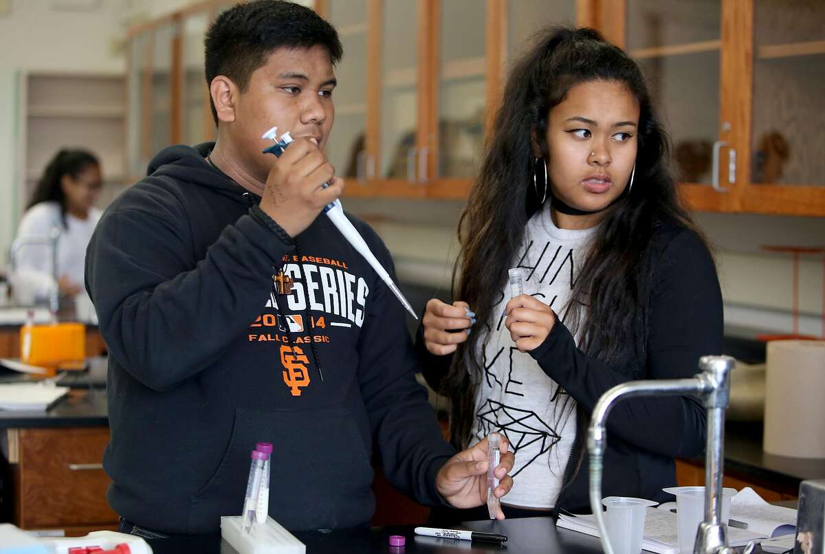 Seniors Michael Diaz (left), 16 years old, and Rebekah Karlagan (right), 17 years old, do lab on samples of milk to find out which curdling process works the fastest during a Biotechnology class at El Camino High School on Monday, August 29, 2016, in South San Francisco, Calif. Genetech is donating $7.8 million to help build Science Garage, a 6900 square-foot state-of-the-art lab and classroom at South San Francisco high school. The project is part of Genentech's $18 million Futurelab program which addresses science and technology barriers at South San Francisco schools. Science Garage will serve 1,000 students at South San Francisco High School and El Camino High School.