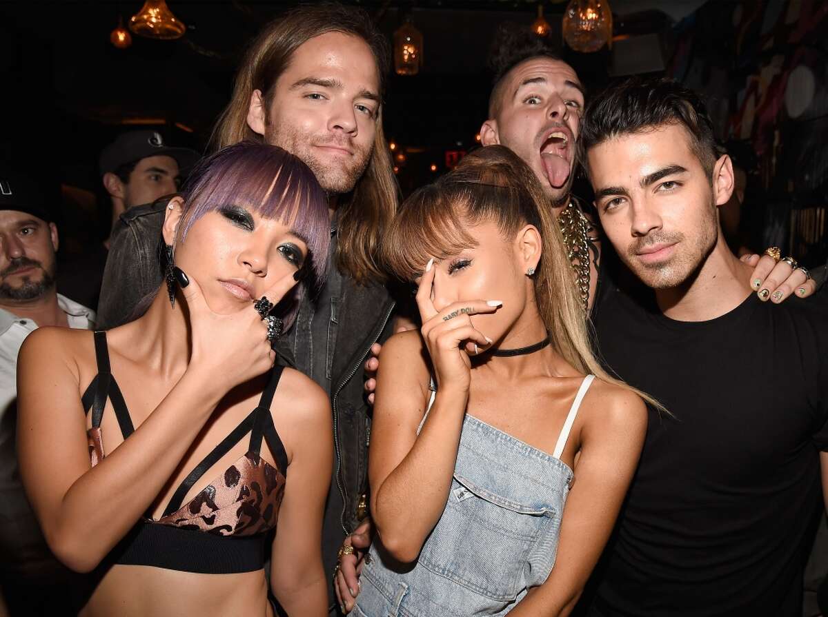 JinJoo Lee, Jack Lawles, Cole Whittle, and Joe Jonas of DNCE pose with singer Ariana Grande (C) duringthe 2016 MTV Video Music Awards Republic Records After Party on August 28, 2016 in New York City.