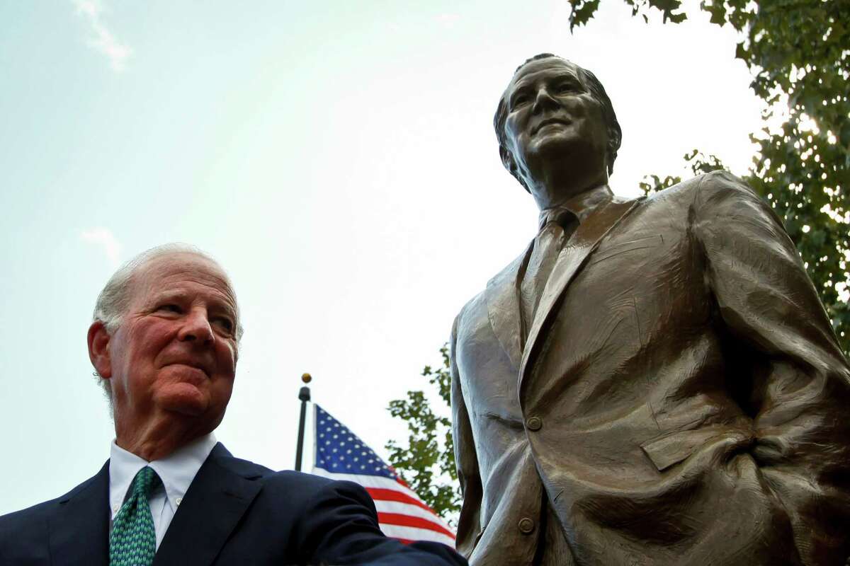 Former Secretary of State James Baker III stands in front of the newly unveiled James A. Baker Monument during a dedication ceremony at the "Baker Common", a small portion of land at the corner of Sesquicentennial Park bounded by Smith and Preston and Buffalo Bayou, Tuesday, Oct. 26, 2010, in Houston. A native Houstonian, James A. Baker, III, served as our nation's 61st Secretary of State. The new statue looks towards a statue of President Bush, whose personal and political life was intertwined with Secretary Baker's. ( Michael Paulsen / Houston Chronicle )