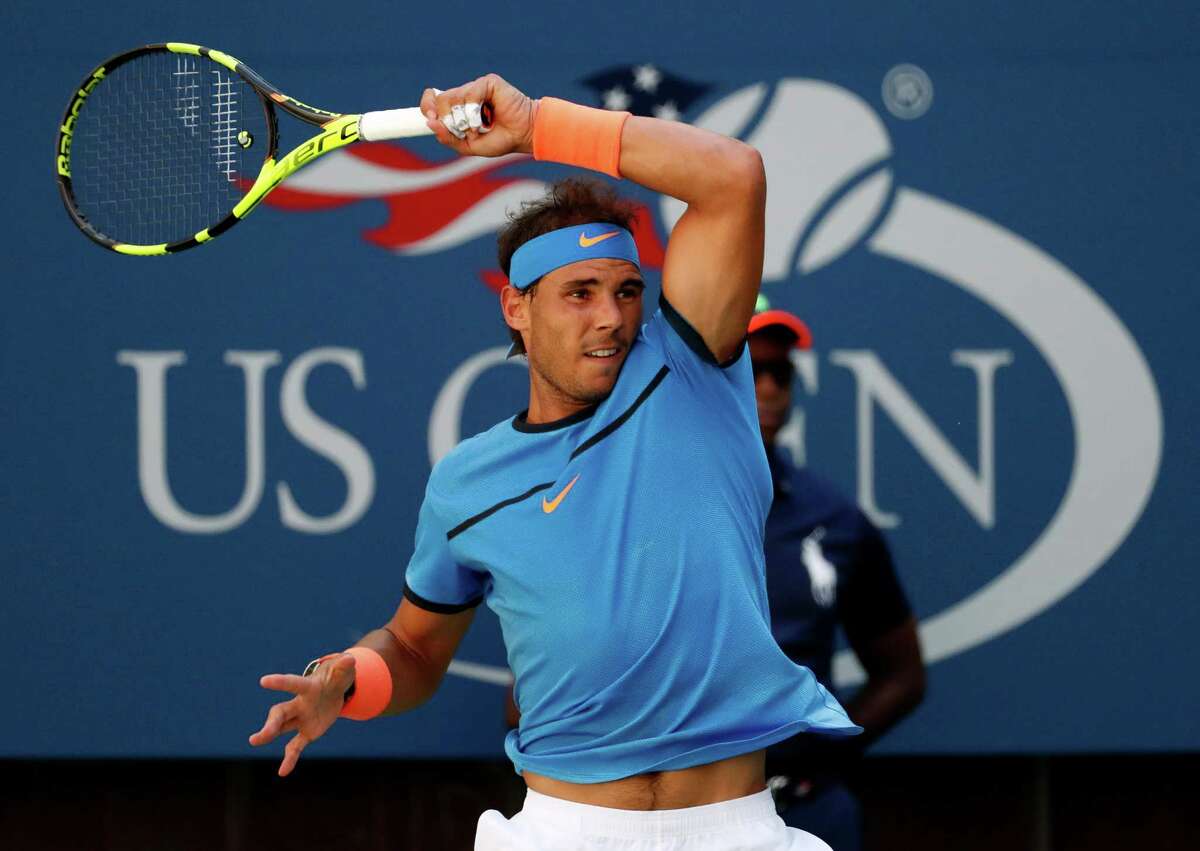 Rafael Nadal, of Spain, returns a shot to Denis Istomin, of Uzbekistan, during the first round of the U.S. Open tennis tournament, Monday, Aug. 29, 2016, in New York. (AP Photo/Alex Brandon) ORG XMIT: USO241
