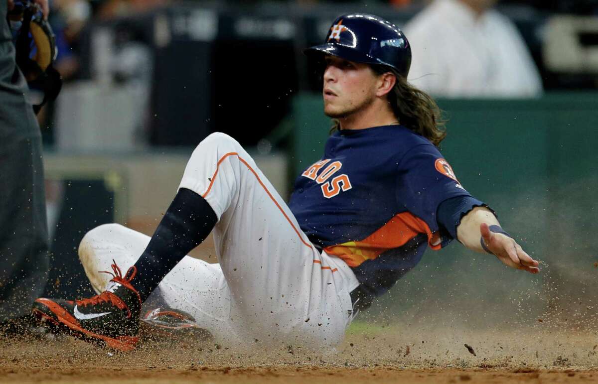 Houston Astros Colby Rasmus slides across home plate after scoring on a double hit by Carlos Gomez against the Los Angeles Angels during the third inning at Minute Maid Park Sunday, July 24, 2016, in Houston. ( Melissa Phillip / Houston Chronicle )
