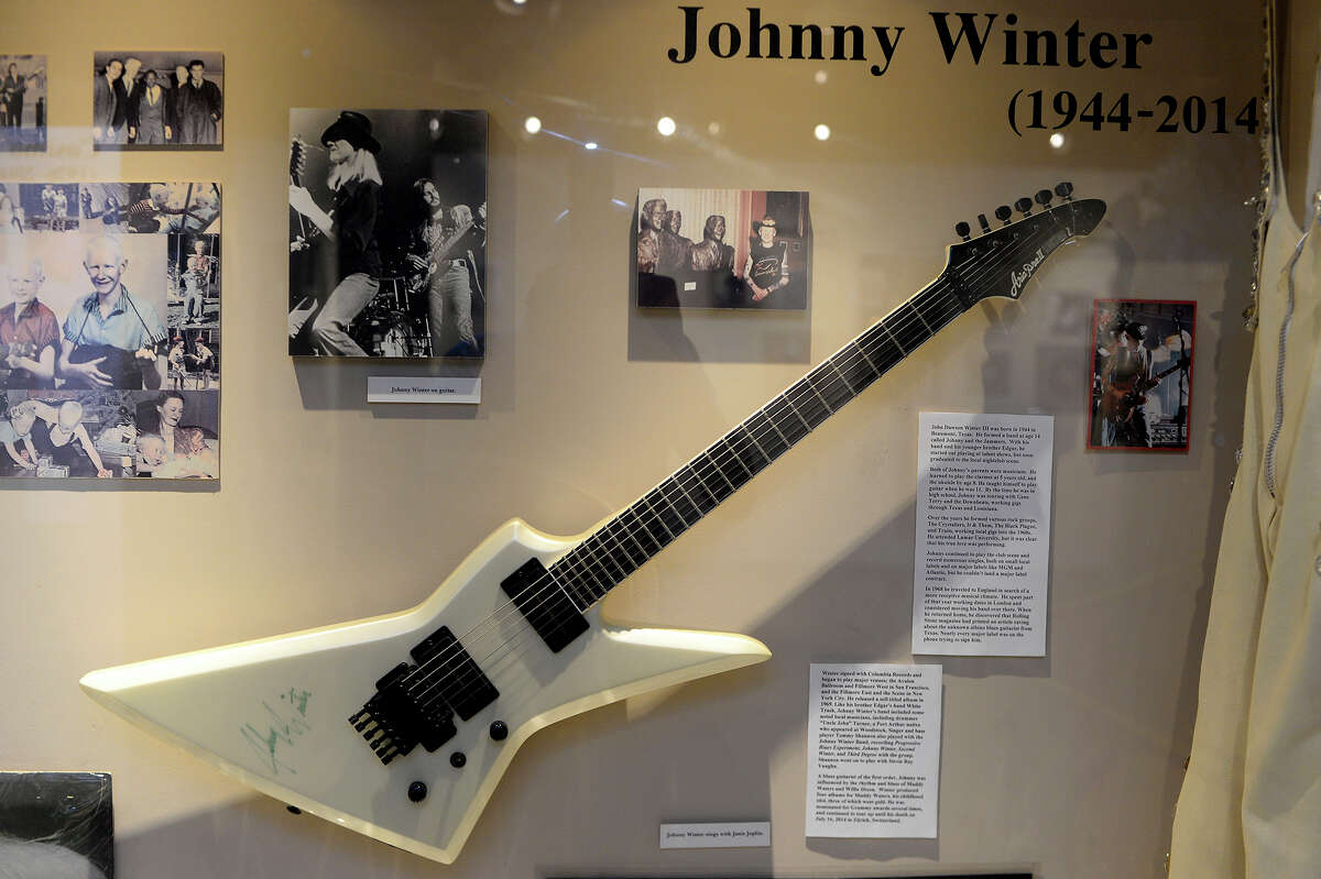 A guitar signed by Johnny Winter on display with photos and other memorabilia at the Museum of the Gulf Coast. Photo taken Monday 8/29/16 Ryan Pelham/The Enterprise