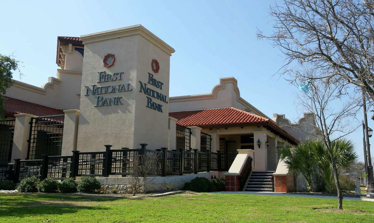 A former First National Bank branch in San Antonio is shown in this January 2013 photo. Former bank officers and directors have agreed to collectively pay $1.5 million to settle claims made by the Federal Deposit Insurance Corp.