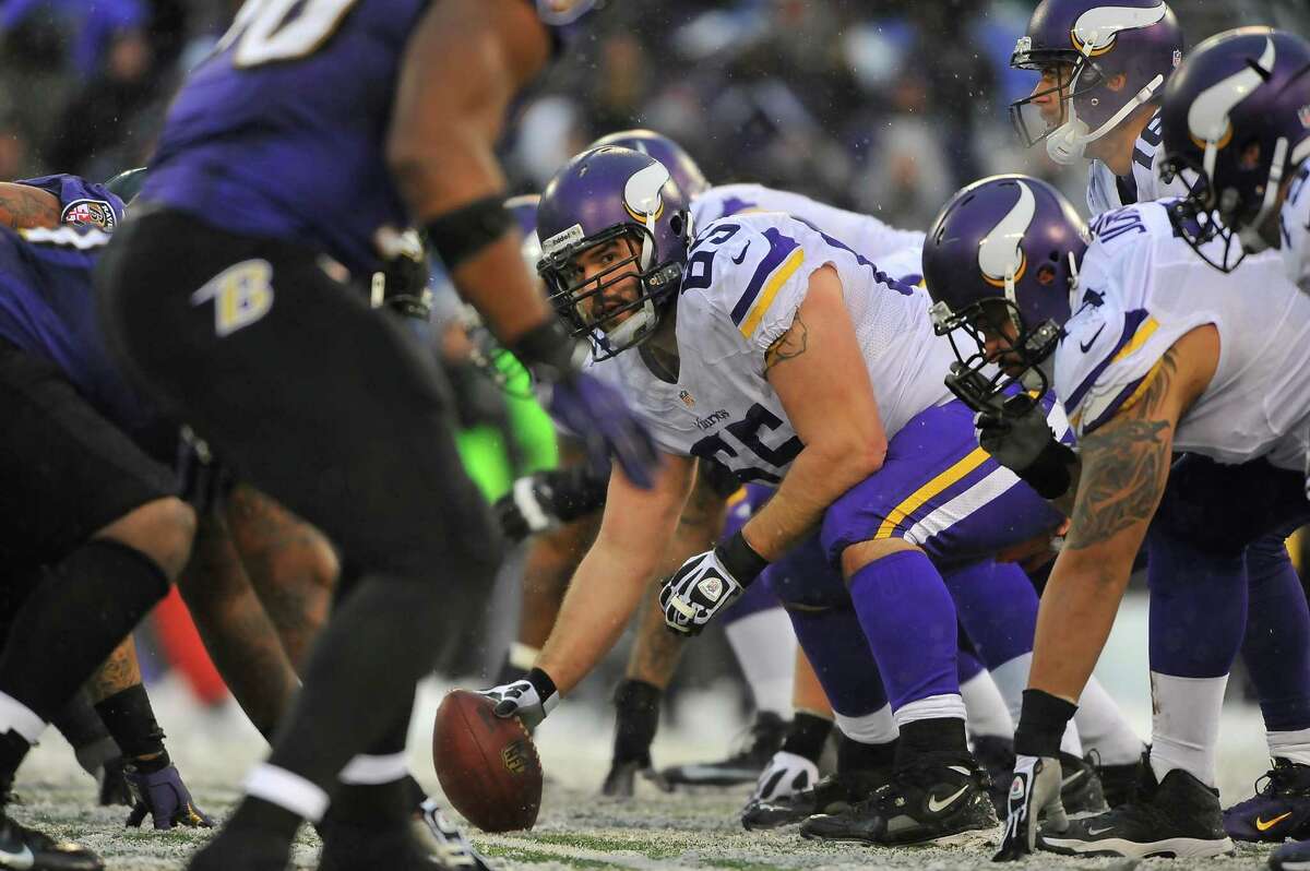 BALTIMORE, MD - DECEMBER 08: Center John Sullivan #65 of the Minnesota Vikings prepares to snap the ball Baltimore Ravens at M&T Bank Stadium on December 8, 2013 in Baltimore, Maryland. The Ravens defeated the Vikings 29-26. (Photo by Larry French/Getty Images)