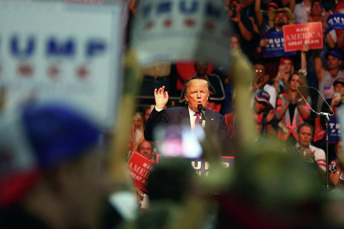 Candidate Trump speaks to Everett rally in 2016.  Two years into his presidency, national poll shows approval rating of 38 percent, 64 percent believe he committed criminal acts before taking office. .
