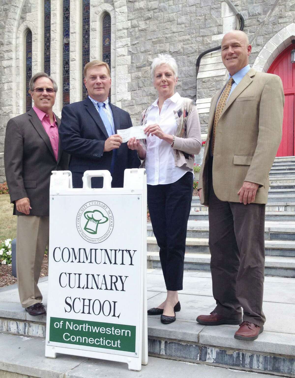 Supporting the culinary arts The Community Culinary School of Northwestern Connecticut based in New Milford was recently the beneficiary of a donation from Nicholas/Tobin & Associates totaling $6,200. The donation was raised at the 10th annual A Taste of New Milford held Sept. 9, 2015, on the Village Green in town. The Greater New Milford Chamber of Commerce event, which is sponsored and organized by Nicholas/Tobin & Associates Insurance, drew over 850 people to sample delicacies from over 30 restaurants, bakers and caterers. Local wineries and breweries were also in attendance. Above, Dawn Hammacott, executive director of the school, second from right, is presented by the check by, from left to right, Kyle Brady, regional sales representative at Nicholas/Tobin, Richard Herrington, president of Nicholas/Tobin, and Jeffrey Kilberg, vice president of Nicholas/Tobin. For more information about the school, call 203-512-5791 or visit www.communityculinaryschool.org. Courtesy of the Community Culinary School of Northwestern Connecticut
