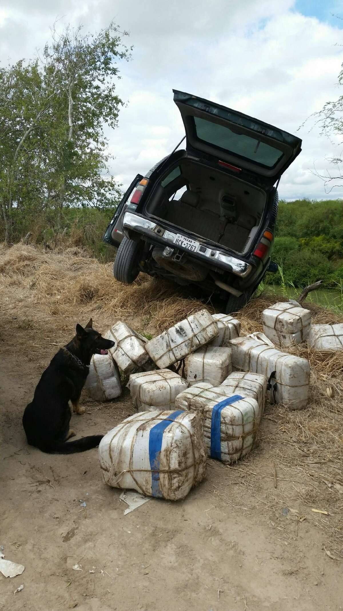 The driver and passengers of this SUV allegedly tried swimming back to Mexico after crashing the drug laden vehicle into the Rio Grande, US Customs Border Protection agents say.