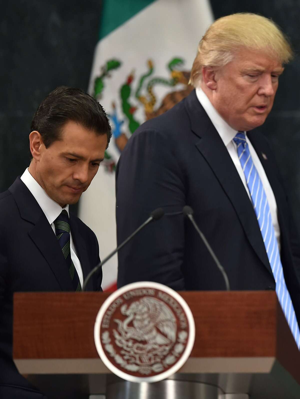 US presidential candidate Donald Trump (R) and Mexican President Enrique Pena Nieto prepare to deliver a joint press conference in Mexico City on August 31, 2016. Donald Trump was expected in Mexico Wednesday to meet its president, in a move aimed at showing that despite the Republican White House hopeful's hardline opposition to illegal immigration he is no close-minded xenophobe. Trump stunned the political establishment when he announced late Tuesday that he was making the surprise trip south of the border to meet with President Enrique Pena Nieto, a sharp Trump critic. / AFP PHOTO / YURI CORTEZYURI CORTEZ/AFP/Getty Images
