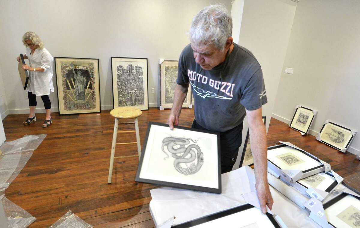 Wood carving prints on display in Norwalk