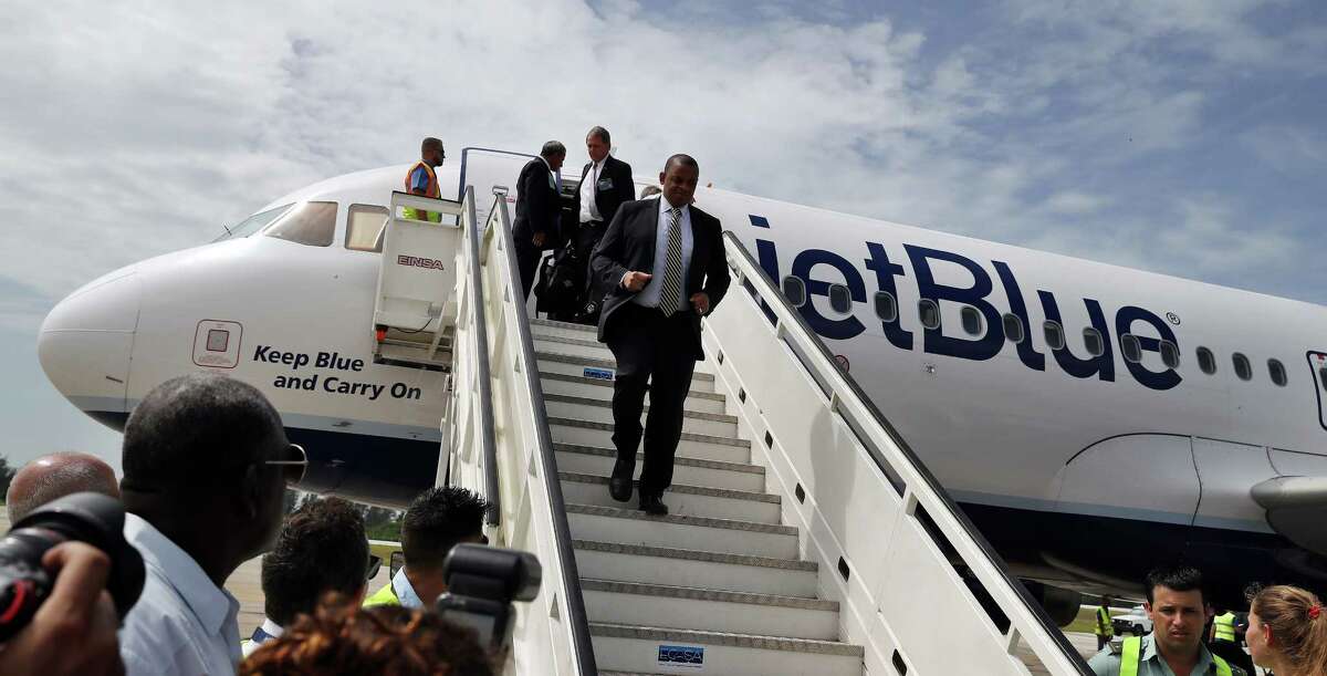U.S. Transportation Secretary Anthony Foxx deplanes from the JetBlue flight 387 at the airport in Santa Clara, Cuba, Wednesday, Aug. 31, 2016. The arrival of the flight opens a new era of U.S.-Cuba travel with about 300 flights a week connecting the U.S. with an island cut off from most Americans by the 55-year-old trade embargo on Cuba and formal ban on U.S. citizens engaging in tourism on the island. (Alejandro Ernesto, Pool via AP) ORG XMIT: XLAT120