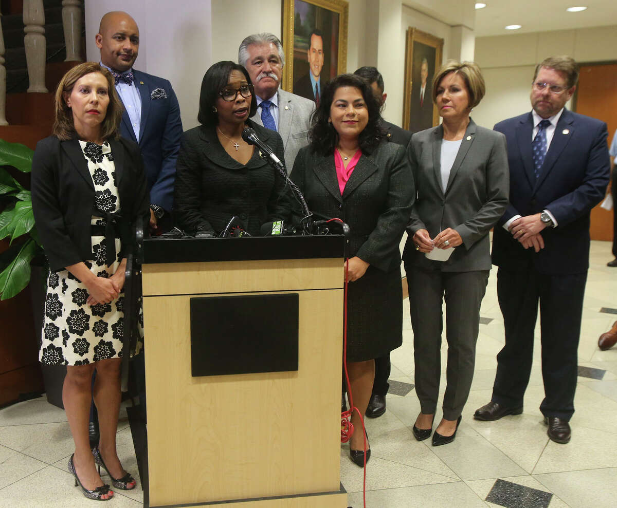 San Antonio Mayor Ivy Taylor (by microphone) speaks Thursday September 1, 2016 after the City Council voted to pass the police collective bargaining agreement.