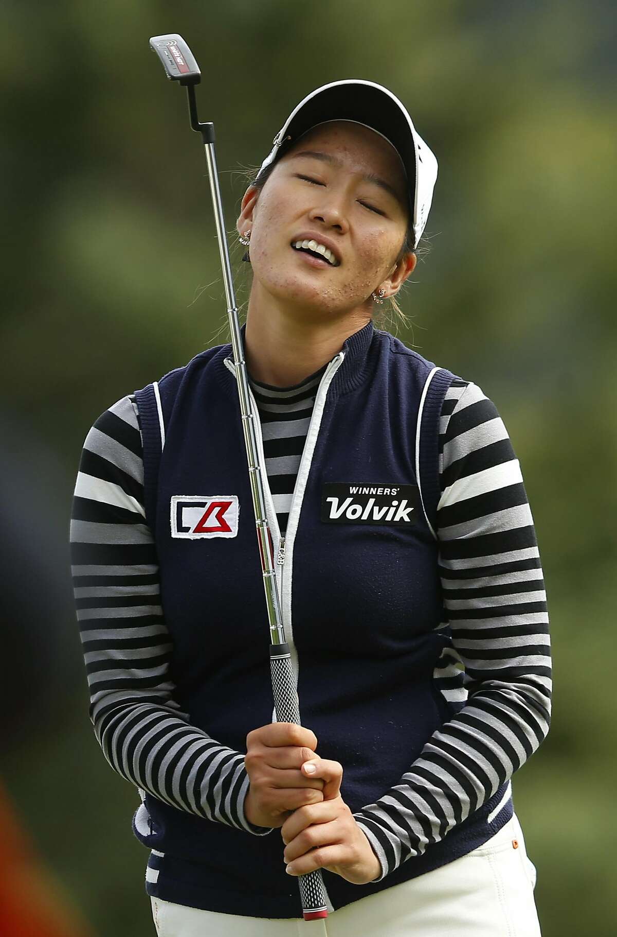 CALGARY, AB - AUGUST 28: Chella Choi of South Korea reacts to her putt on the 18th hole during the final round of the Canadian Pacific Women's Open at Priddis Greens Golf and Country Club on August 28, 2016 in Calgary, Canada. (Photo by Todd Korol/Getty Images)