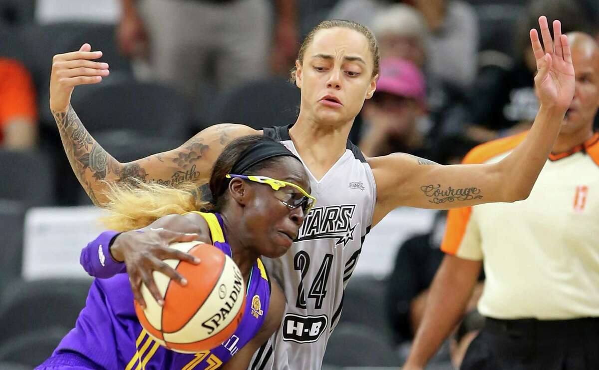 Stars’ Jazmon Gwathmey defends the Los Angeles Sparks’ Essence Carson during first-half action on Sept. 1, 2016, at the AT&T Center.