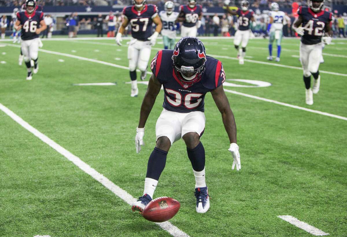 Houston Texans safety K.J. Dillon (36) downs a punt inside the 10-yard line during the fourth quarter of an NFL pre-season football game against the Dallas Cowboys at AT&T Stadium on Thursday, Sept. 1, 2016, in Arlington, Texas.
