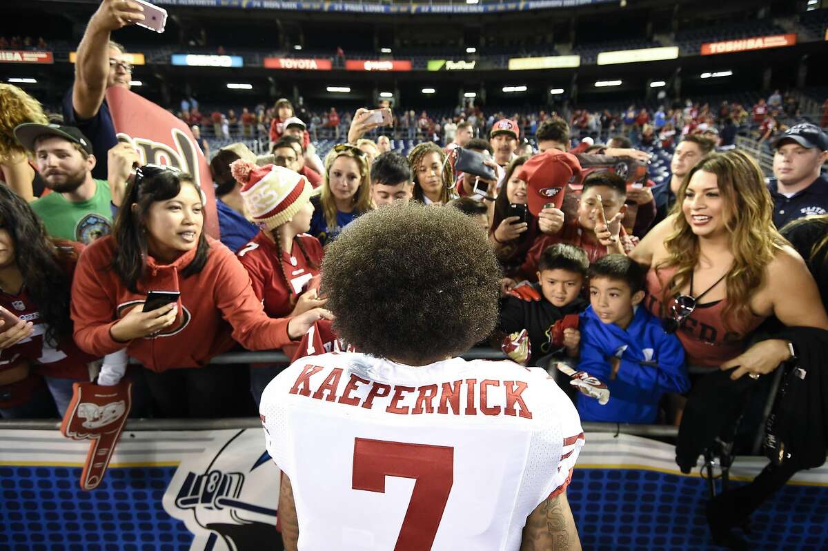 San Francisco 49ers quarterback Colin Kaepernick greets fans after their 21-31 win against the San Diego Chargers during an NFL preseason football game Thursday, Sept. 1, 2016, in San Diego. (AP Photo/Denis Poroy)