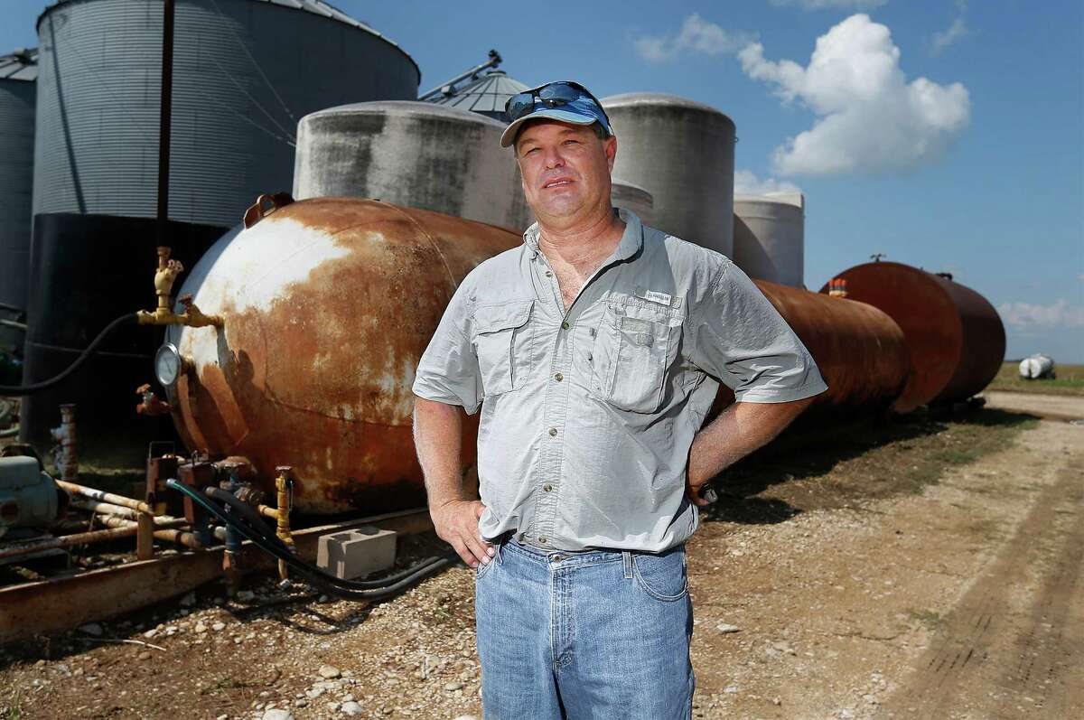 Anhydrous ammonia is used as fertilizer in farming for decades. Like many farmers Charles Krakau (pictured), uses anhydrous ammonia on his farm land in Barbarosa, Texas in Guadalupe County. Krakau also sells the fertilizer to nearby farmers as well. In the wake of the West, Texas Fertilizer Plant explosion in 2013, new federal regulations overseeing agricultural fertilizers like anhydrous ammonia and ammonium nitrate will come into effect on October 1 and fines for non-compliance with the new regulations can be steep. Krakau, posing for a portrait by his 20-ton tank of anhydrous ammonia, said he has already received such a fine when he sold anhydrous ammonia to another farmer but the tank in which the chemical solution was transported was not properly tagged and thus Krakau received a fine. The cost for compliance may put retailers of the fertilizer out of business particularly smaller operations. Also, the trickle-down costs for farmers to reach compliance or use alternative fertilizers will hurt their bottom lines of which margins are already small. (Kin Man Hui/San Antonio Express-News)